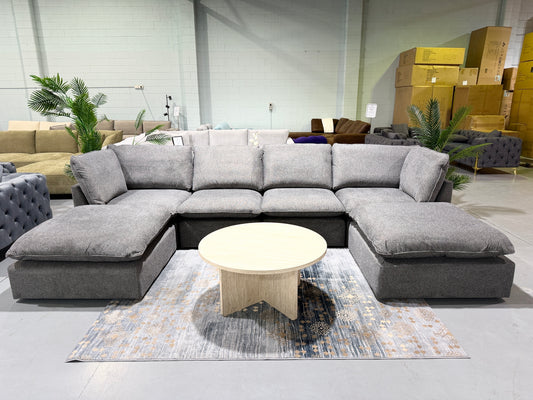 BRIGHTON dark grey fabric modular lounge with two ottomans, showroom view
