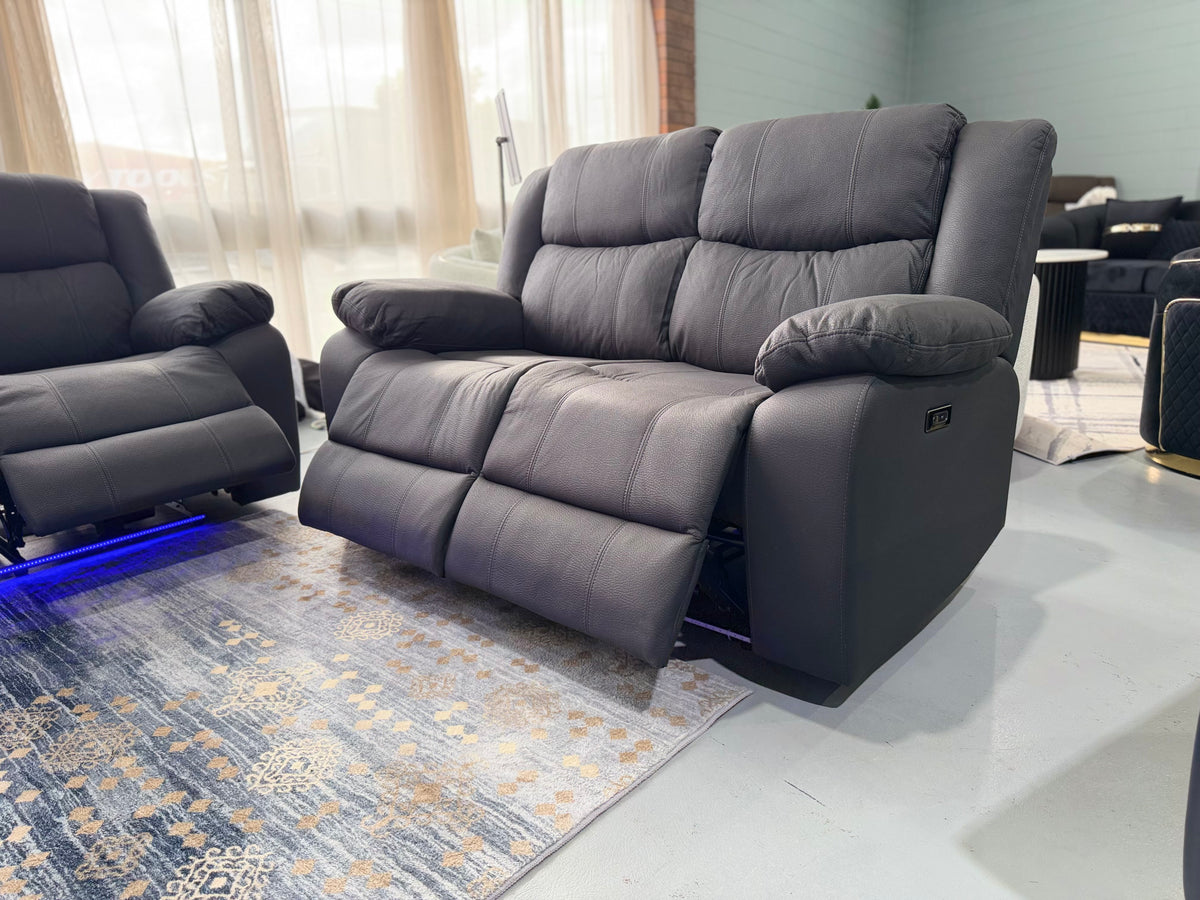 JASON 2 seater electric recliner in black Rhino fabric with both seats reclined and the power button on the arm