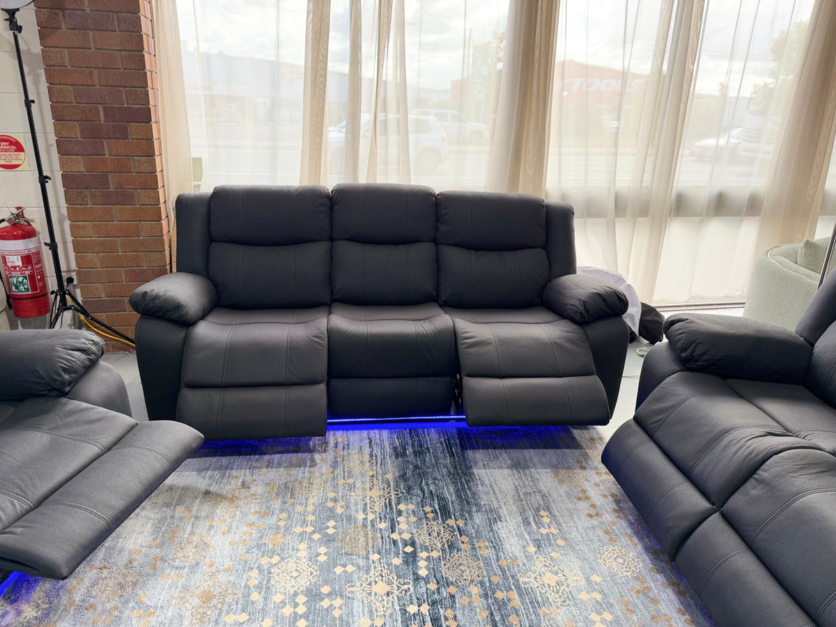 JASON 3 seater electric recliner in black Rhino fabric, front view with one end reclined and the LED strip lit underneath